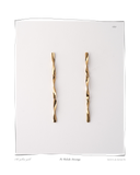 Tri Colocho Earrings, pair laid flat on a white background, solid 18k yellow gold twisted drop earrings with soft organic curves. Tarnish-resistant and made for everyday wear — Maya & Mason handcrafted fine jewellery.