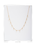 Pearl Mini Necklace, laid flat on a white background, a solid 18k gold chain necklace with small dangling freshwater pearls. Tarnish-resistant and made for everyday wear — Maya & Mason handcrafted fine jewellery.