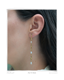 Pearl Tri Colocho earring worn on a model's ear, a solid 18k gold twisted drop earring with three freshwater pearls. Tarnish-resistant and made for everyday wear — Maya & Mason handcrafted fine jewellery.