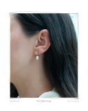 Pearl Droplet Earrings worn on a model's ear, a solid 18k gold stud earring finished with a freshwater pearl drop. Tarnish-resistant and made for everyday wear — Maya & Mason handcrafted fine jewellery.