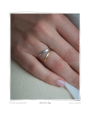 Mixed Duo Ring, close-up worn on a model's hand resting on cream fabric, a set of two solid 18k gold formed rings, one white gold and one yellow gold. Tarnish-resistant and made for everyday wear — Maya & Mason handcrafted fine jewellery.