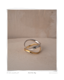 Mixed Duo Ring, White and Yellow Gold, product shot on a beige textured surface, a set of two solid 18k gold formed rings, one white gold and one yellow gold. Tarnish-resistant and made for everyday wear — Maya & Mason handcrafted fine jewellery.