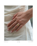 Lace Ring worn on a model's hand resting on cream fabric, a solid 18k gold ring with an intricately linked lacework design. Tarnish-resistant and made for everyday wear — Maya & Mason handcrafted fine jewellery.