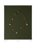 Curl Bracelet laid flat on a dark green background, a solid 18k yellow gold chain bracelet featuring eight signature curl charms. Tarnish-resistant and made for everyday wear — Maya & Mason handcrafted fine jewellery.