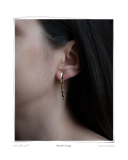 Cascade Earring worn on a model's ear, a solid 18k yellow gold dangle earring made from cascading curl links. Tarnish-resistant and made for everyday wear — Maya & Mason handcrafted fine jewellery.