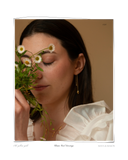 Chain Curl Earring worn on a model's ear in a portrait-style lifestyle shot, a solid 18k yellow gold threader chain earring with a curl-shaped drop. Tarnish-resistant and made for everyday wear — Maya & Mason handcrafted fine jewellery.
