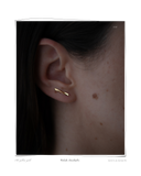 Colocho Ear Climber, Yellow Gold worn on a model's ear, a solid 18k yellow gold ear climber. Tarnish-resistant and made for everyday wear — Maya & Mason handcrafted fine jewellery.