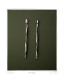 Verse Earrings, White Gold, pair laid flat on a dark green background, elongated solid 18k white gold drop earrings. Tarnish-resistant and made for everyday wear — Maya & Mason handcrafted fine jewellery.