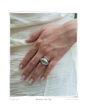 Aquamarine Dome ring worn on a model's hand, a solid 18k white gold dome ring set with an aquamarine stone. Tarnish-resistant and made for everyday wear — Maya & Mason handcrafted fine jewellery.